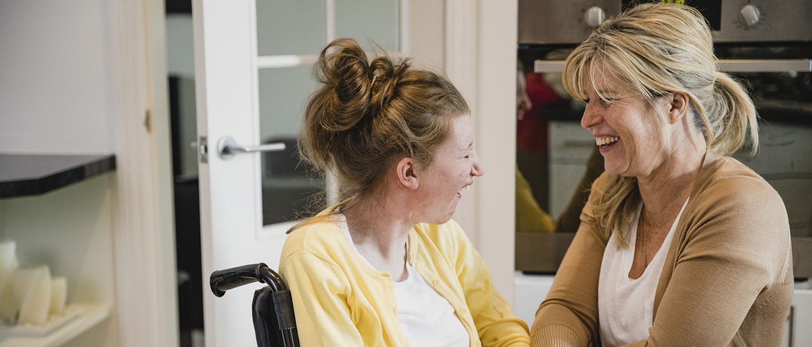 Mum and Disabled Daughter in Kitchen iStock 1044763668 v2